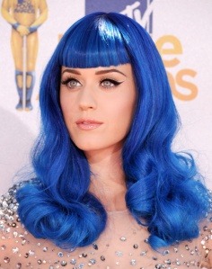 In 2010, her hair was a little more risky. It was bright blue and curly! 